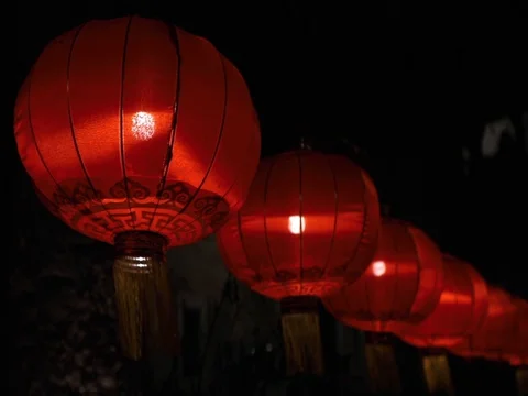 Chinese lantern &amp; light bulb on dark background. Stock Footage 129748294