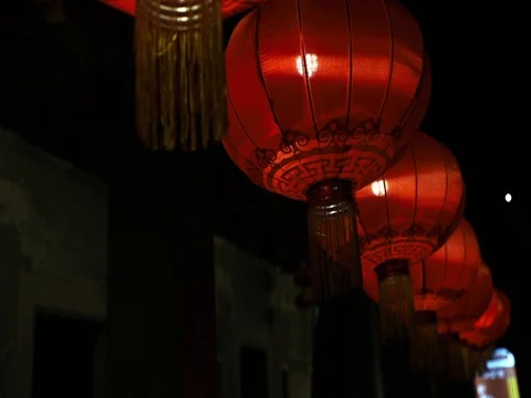 Chinese lantern &amp; light bulb on dark background. Stock Footage 129748723