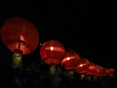 Chinese lantern &amp; light bulb on dark background. Stock Footage 129752946