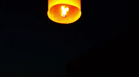 Chinese  lantern soars into the sky at night Video stock 33717883