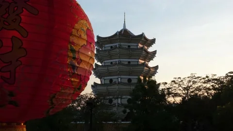 Chinese lantern in from of tower sunset time Stock Footage 146505476