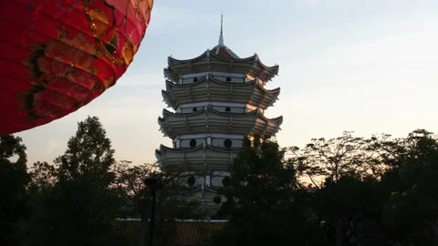 Chinese lantern in from of tower sunset time Stock Footage 146505486
