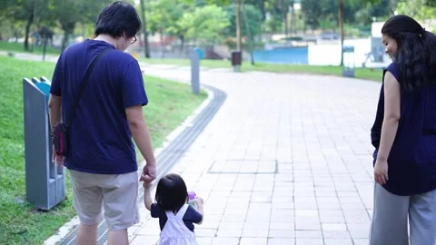 Chinese Malaysian parents playing with 1-year-old daughter Stock Footage 285581453