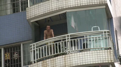 Chinese man looking down from balcony, China Stock Footage 54489441
