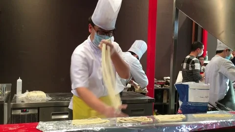Chinese man makes spaghetti 4k Stock Footage 72399685
