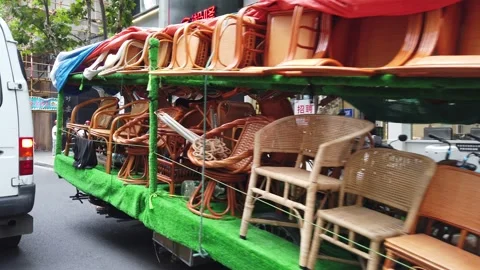 Chinese man pulling heavy chairs cart on the street in Shanghai, 4K Stock Footage 158793955