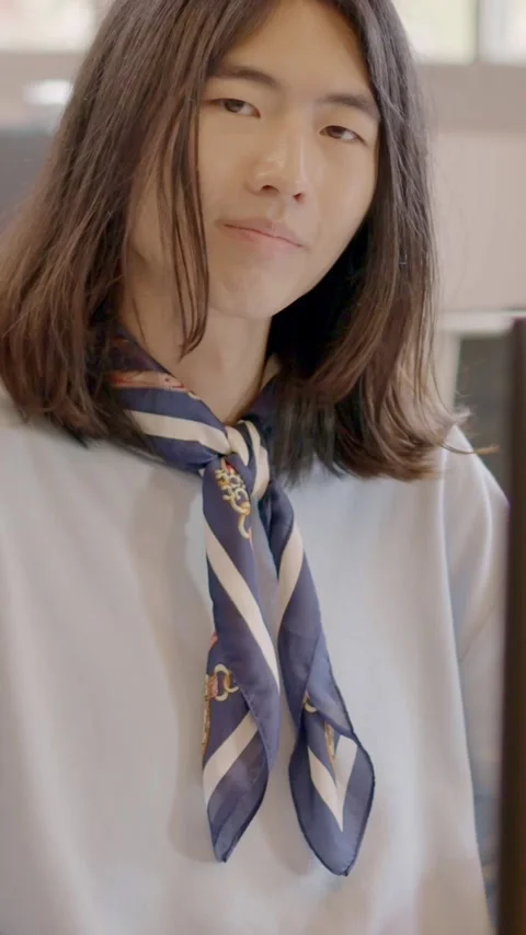 Chinese man working with computer and smiling in a coworking Stock Footage 260851776