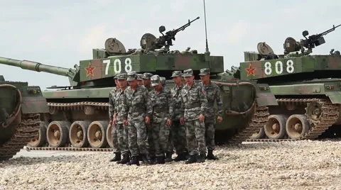 Chinese military run against tanks Stock Footage