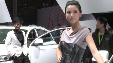 Chinese models posing at Beijing Auto Show Stock Footage 56588183