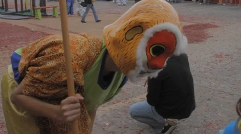 Chinese Monkey King Playing with the Crowd During the New Year Festival Stock Footage 8691203