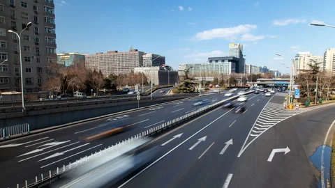 Chinese multi-lane highway at Beijing buildings timelapse Stock Footage 119786331
