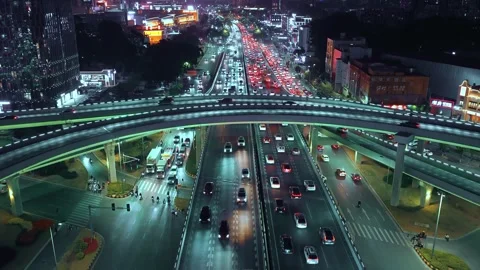 Chinese multi level road. Aerial night cityscape view. Cars drive interchange. Stock Footage 330531196