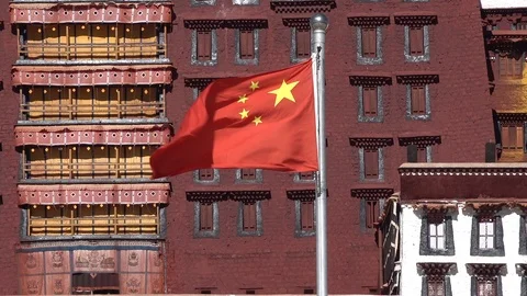 Chinese national flag at Potala Palace, politics religion culture Tibet Stock Footage