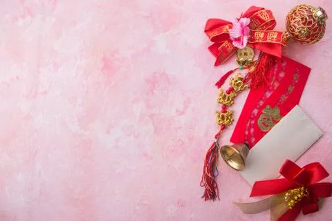 Chinese new year decoration on pink wooden background with copy space. Stock Photos