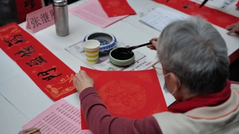 Chinese New Year: Write couplets Stock Footage 297647701