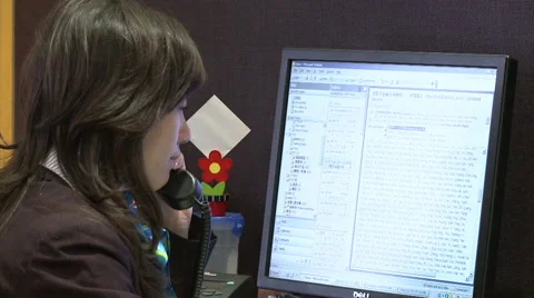 Chinese office worker on phone, computer Stock Footage 54253379