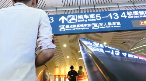 Chinese passengers walking on the elevator at railway STATION Stock Footage 52427455