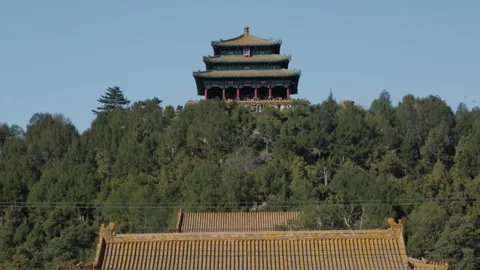 Chinese Pavilion Overlooking Tiled Rooftops and Forested Hill in Beijing Stock Footage 345821292