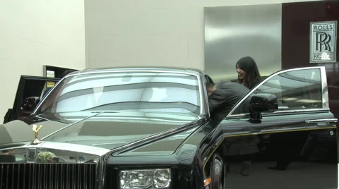 Chinese people, Rolls Royce Phantom, Beijing Stock Footage 56586791