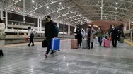 Chinese People With Suitcases Wearing Masks Walk Away From The Train In China Stock Footage