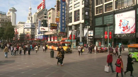 Chinese people walking around downtown Shanghai, Nanjing road Stock Footage