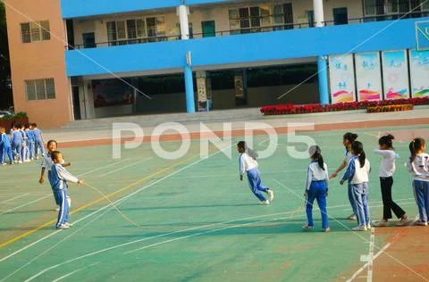 Chinese primary school students in sports, rope skipping Stock Photos