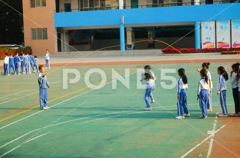 Chinese primary school students in sports, rope skipping Stock Photos