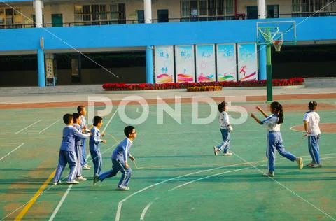 Chinese primary school students in sports, rope skipping Stock Photos