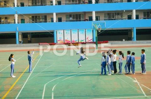 Chinese primary school students in sports, rope skipping Stock Photos