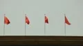 Chinese Red Flags in crowded Tiananmen Square, Beijing, China, Rainy Day HD Footage