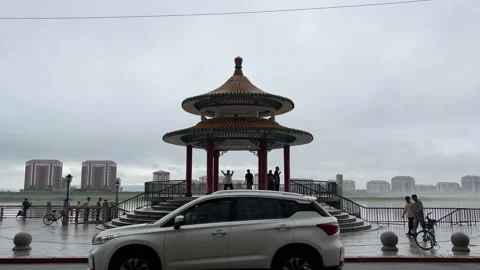 Chinese Riverside Pavilion Faces North Korea Across the Yalu River Stock Footage 340176089