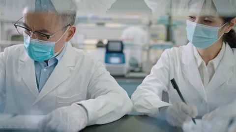 Chinese scientist pipetting samples in laboratory,4K Stock Footage 238587257