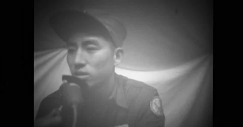 Chinese soldier interviewing a non-repatriate Stock Footage 43444529