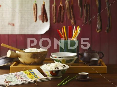 Chinese Store; Hanging Sausages, Rice Bowls and Chopsticks Stock Photos