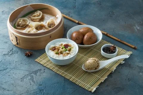 Chinese Streamed Dumpling with tea eggs and porrige Stock Photos