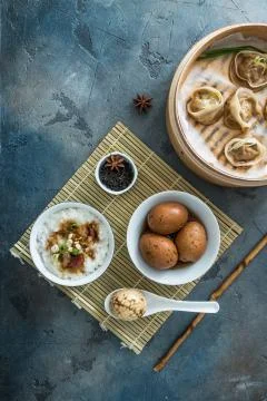 Chinese Streamed Dumpling with tea eggs and porrige Stock Photos
