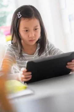 Chinese student using digital tablet 写真素材