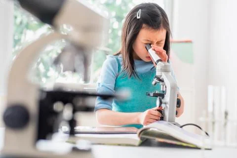 Chinese student using microscope in science lab 스톡 사진