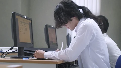 Chinese student working in a Computer Lab 스톡 동영상 98460810