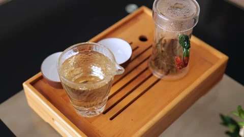 Chinese tea ceremony. composition of tea accessories on a tea board Stock Footage 220342036