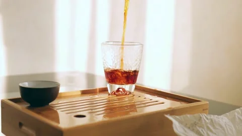 Chinese tea ceremony. Tea master pouring tea into glass cup. Stock Footage 218447832