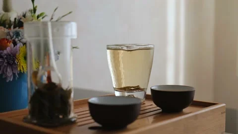 Chinese tea ceremony. tea set on a tea board. brewing elite Chinese white tea Stock Footage 220342190