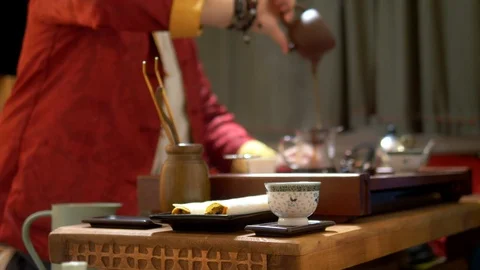 Chinese tea cup in sharpness, on a blurred background of the process of Stock Footage 116566432