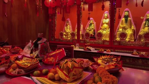 Chinese temple with red lanterns and offerings during Lunar New Year celebration Stock-Footage 336599033