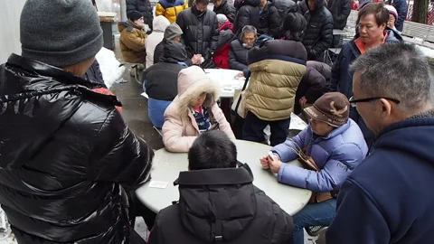 Chinese, throwing cards down. Chinatown, Boston, MA. Stock Footage 216963177