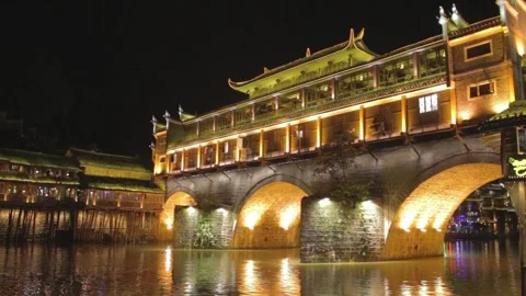 Chinese Traditional Bridge Architecture Illuminated by Lights at Night Stock Footage 167621657