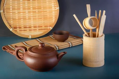 Chinese traditional clay teapot and tea ceremony items on blue table Stock Photos