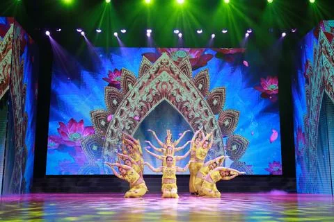 Chinese traditional program thousand hands Guanyin performance on stage. Stock Photos