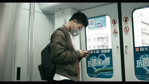 Chinese train commuter, post-lockdown Wuhan, new normal Stock Footage 132575040