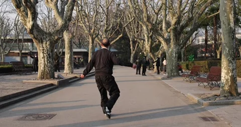Chinese Uncle Practicing Diable Tai Chi Shanghai Park Morning Slow Motion 4K Stock Footage 263100956